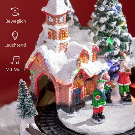 Christmas village with LED lights and moving train