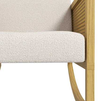 Rocking chair with soft cushions and rattan decor